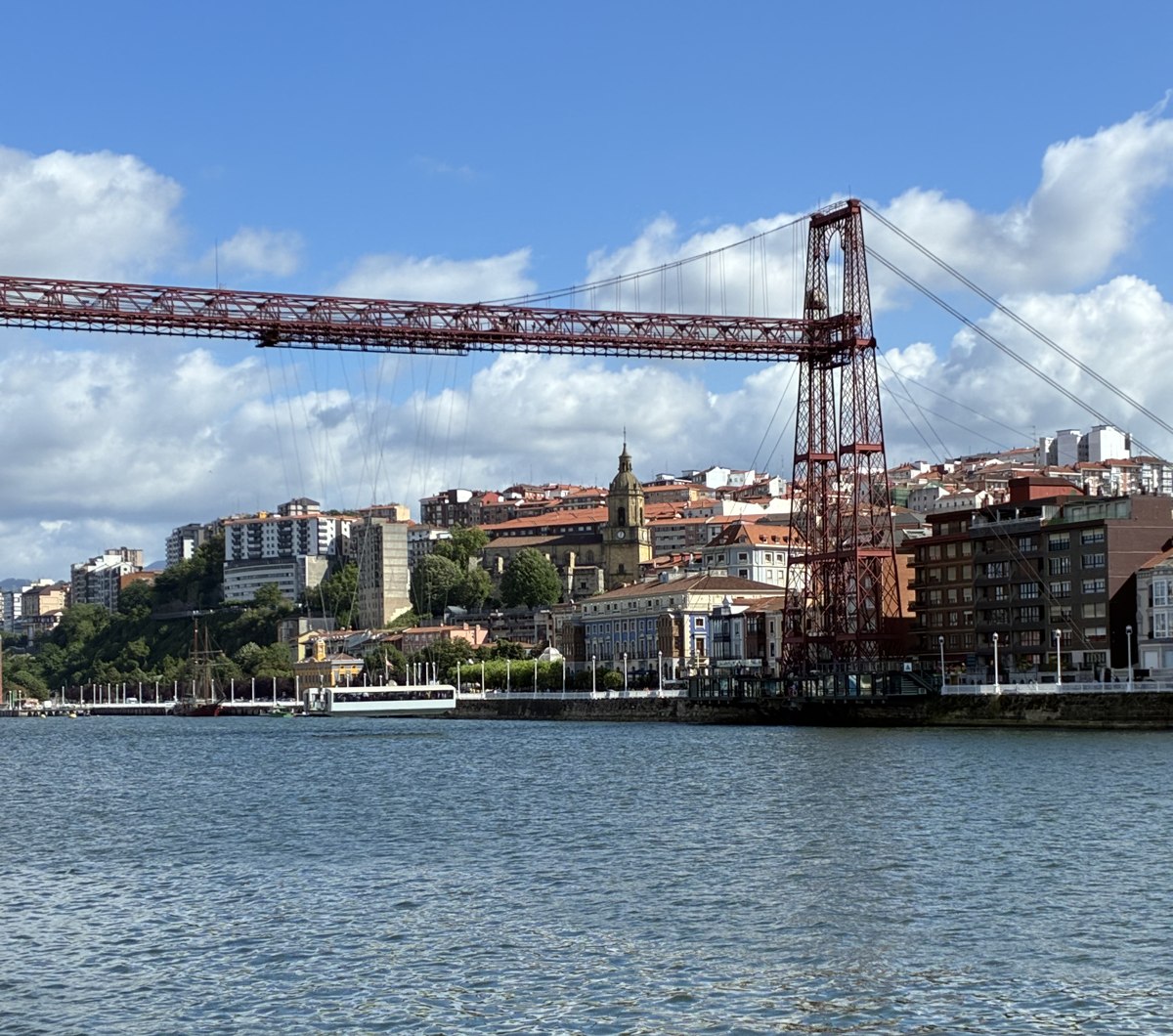 The Vizcaya transporter bridge over the ria at Las Arenas under a blue sky.